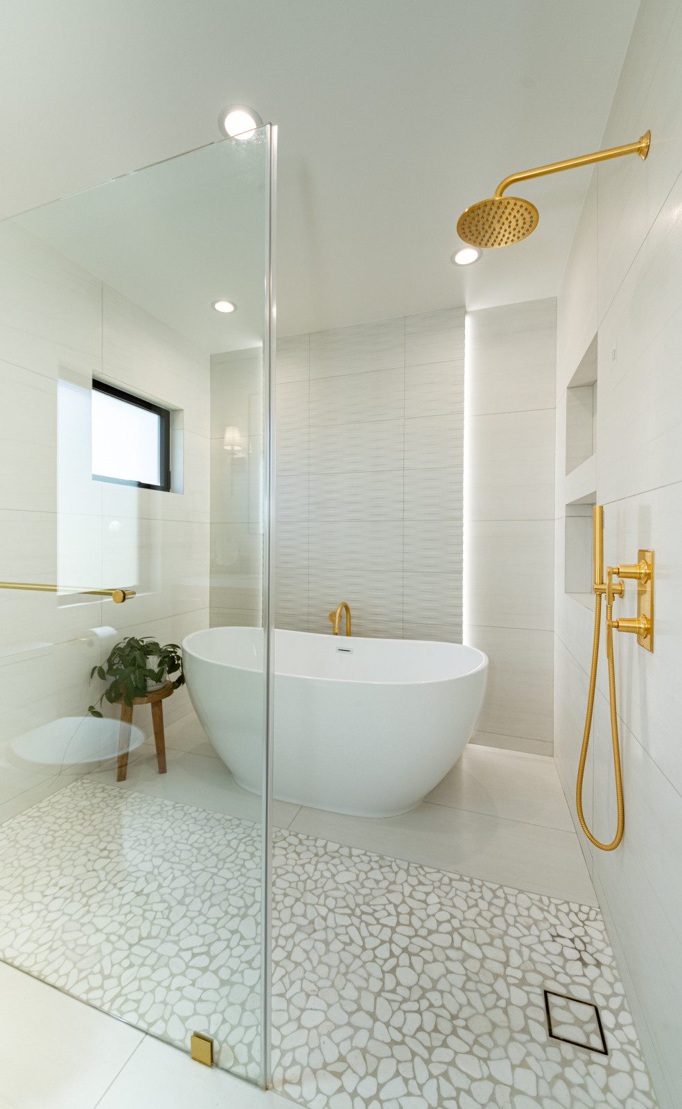 Woodland Hills bathroom — freestanding tub with gold fixtures