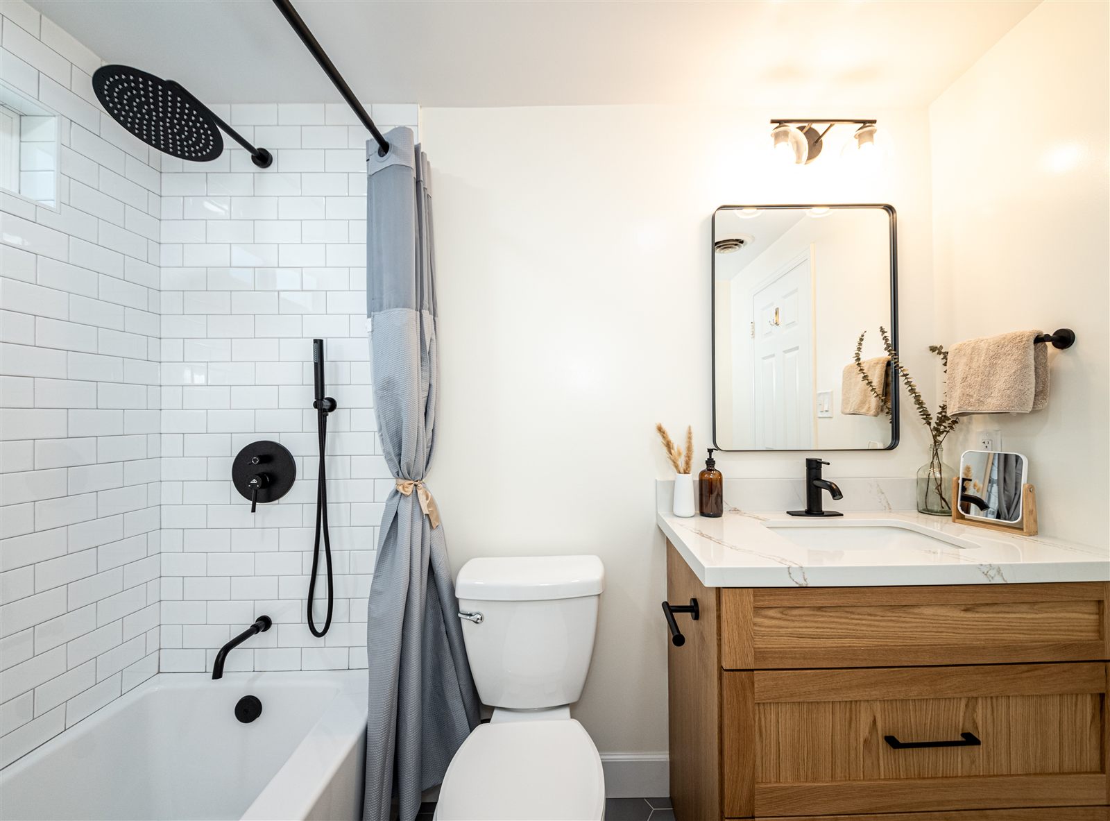 Bathroom with subway tile and matte black fixtures