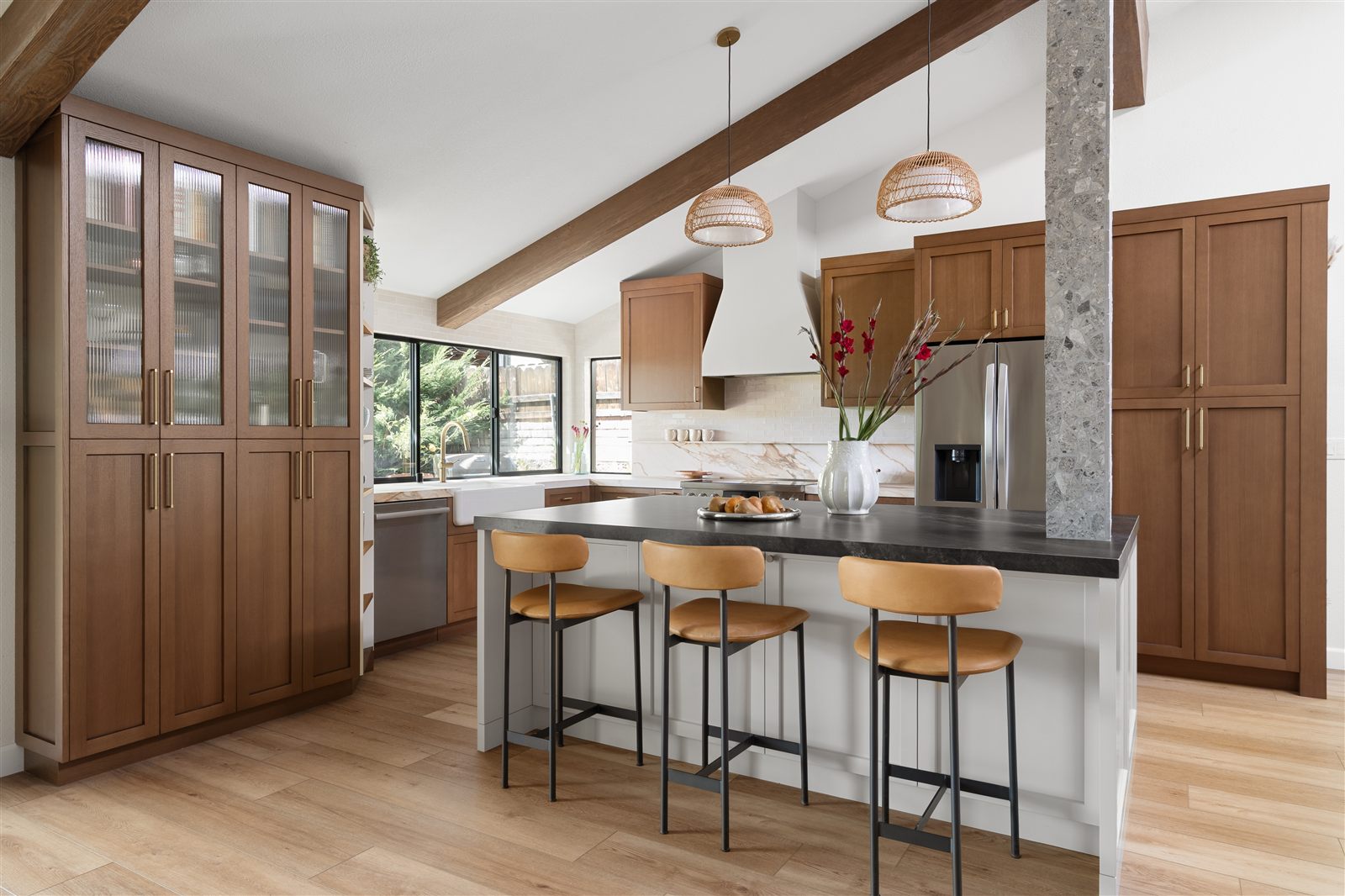 Full kitchen remodel with exposed beams and custom pantry wall in Los Angeles