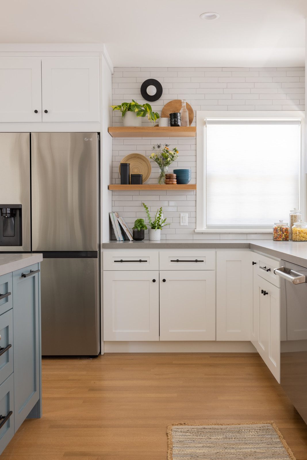White kitchen with open oak shelving
