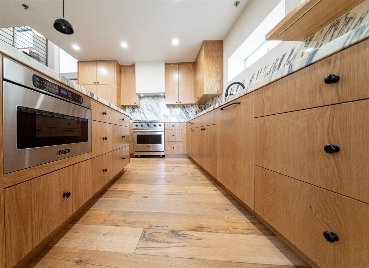 Marina del Rey kitchen remodel â€” warm wood cabinetry with clean modern lines, by ARKO Remodeling