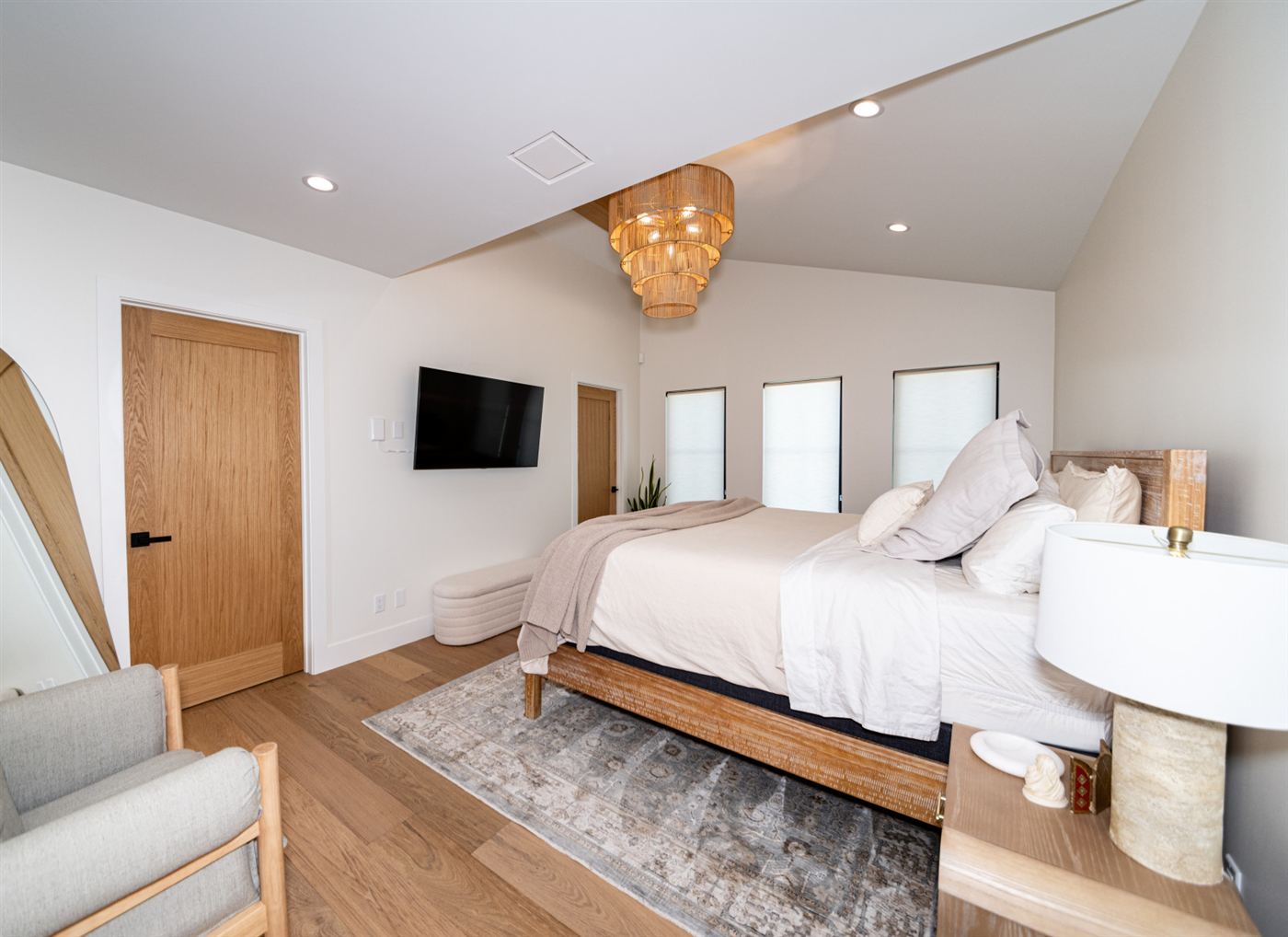 Bedroom with light wood interior door and black handle