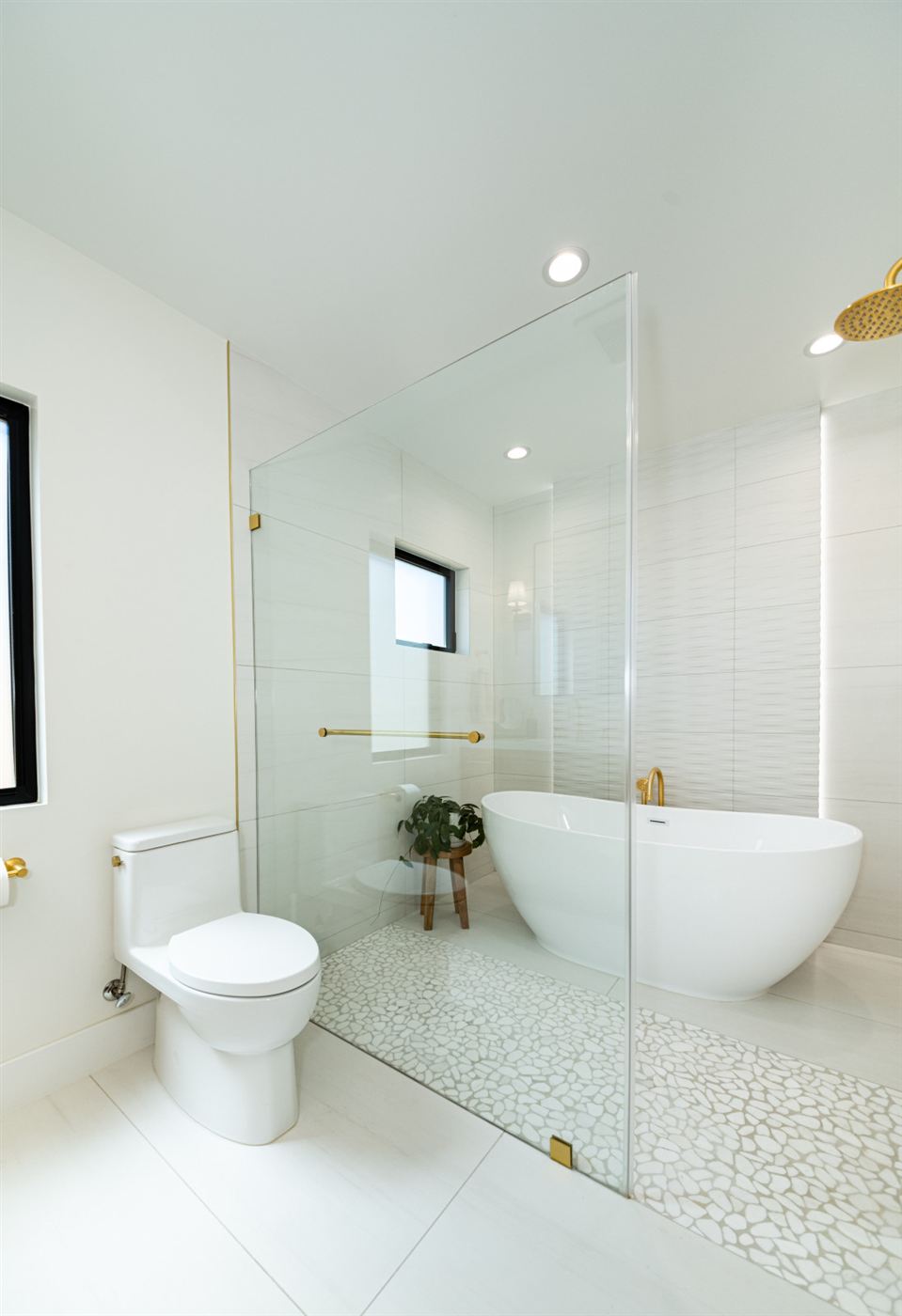 Bathroom in white textures with brushed gold accents