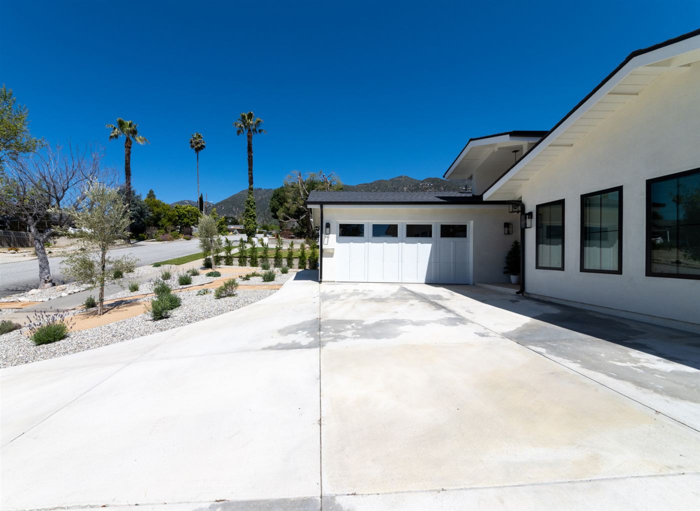 Modern white garage door with rectangular windows