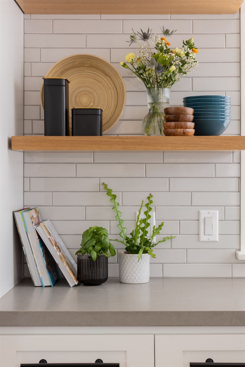 Kitchen detail â€” blue cabinets with black hardware
