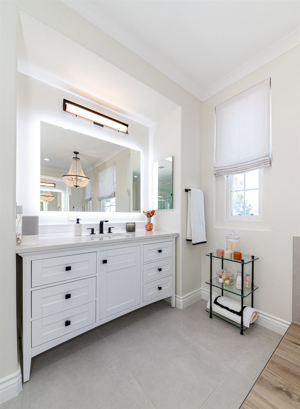 Westlake Village bathroom remodel â€” freestanding tub on wood platform with matte black fixtures