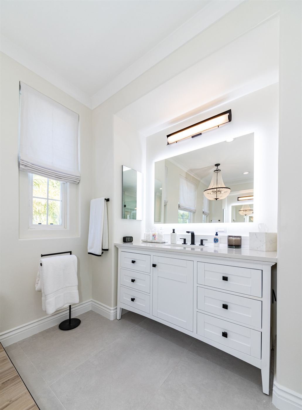 Westlake Village bathroom remodel â€” freestanding tub on wood platform with matte black fixtures