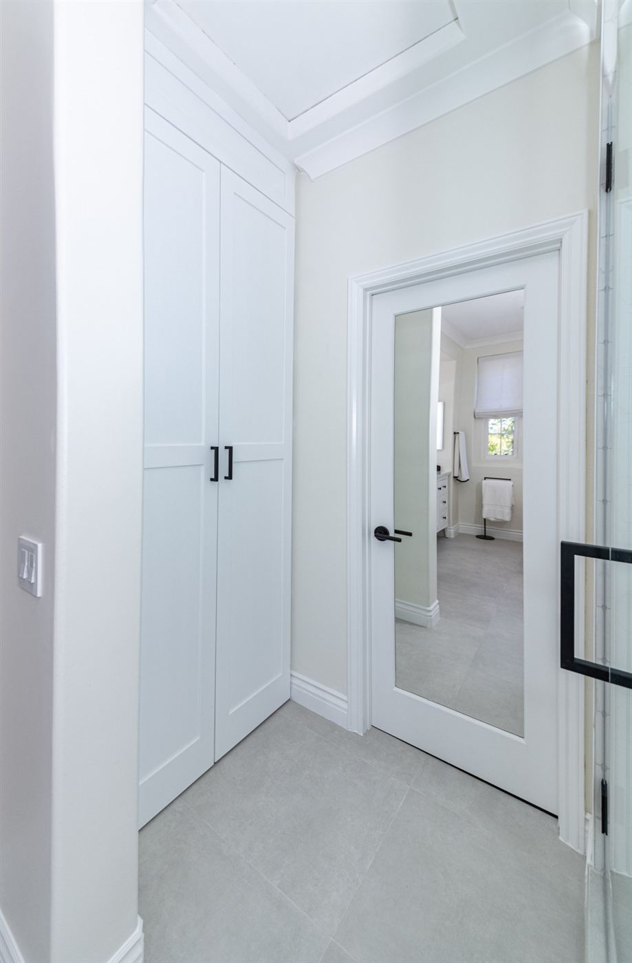 Hallway with closet leading to the bathroom