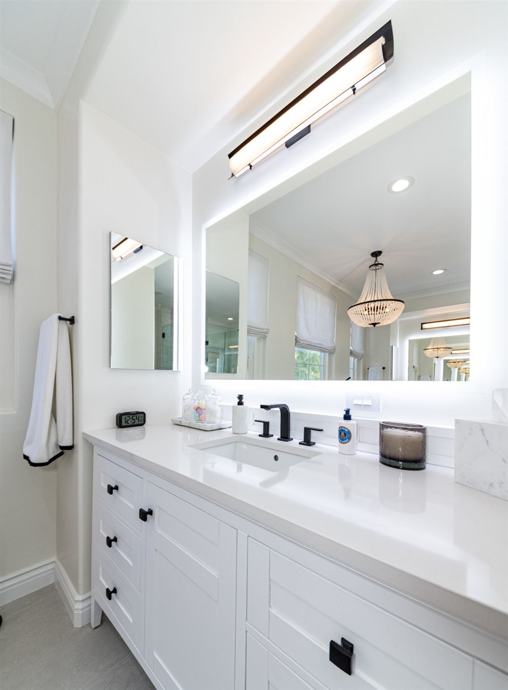 Westlake Village bathroom remodel â€” freestanding tub on wood platform with matte black fixtures